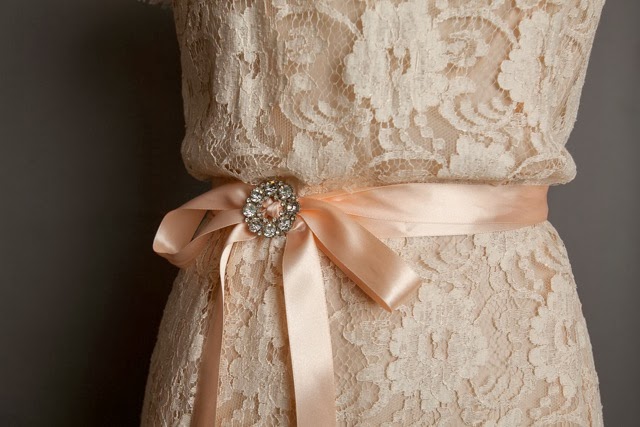 Pastel lace vintage wedding dresses, detail of pastel lace and sash with crystal